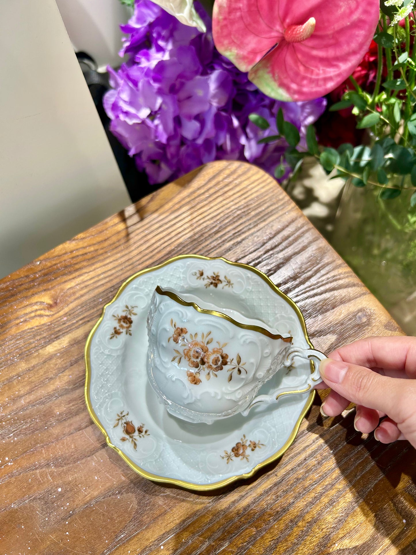 German Lindner Rococo-Style Coffee Cup – 22k Gilded Relief with Brown Floral Accents