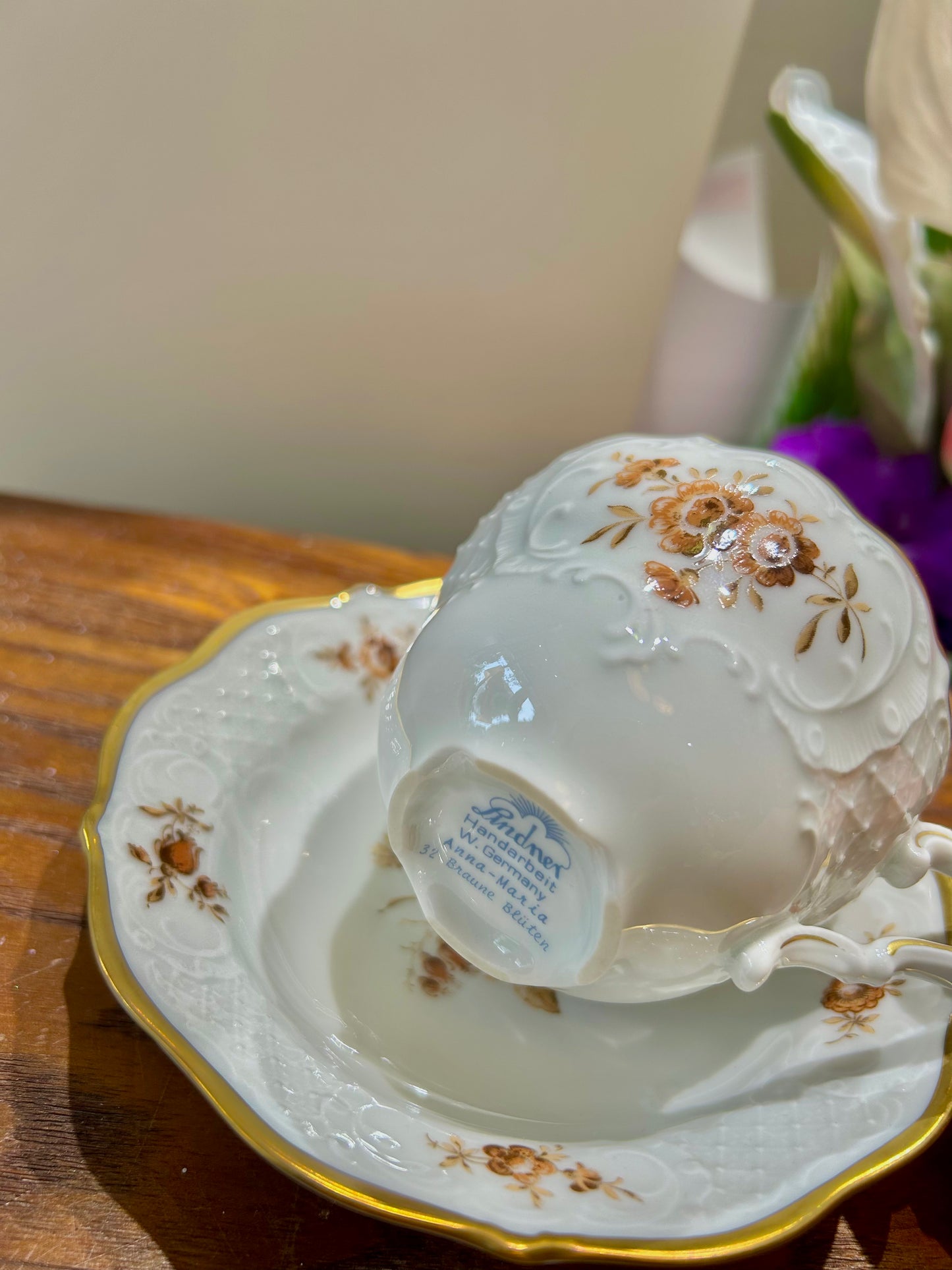 German Lindner Rococo-Style Coffee Cup – 22k Gilded Relief with Brown Floral Accents