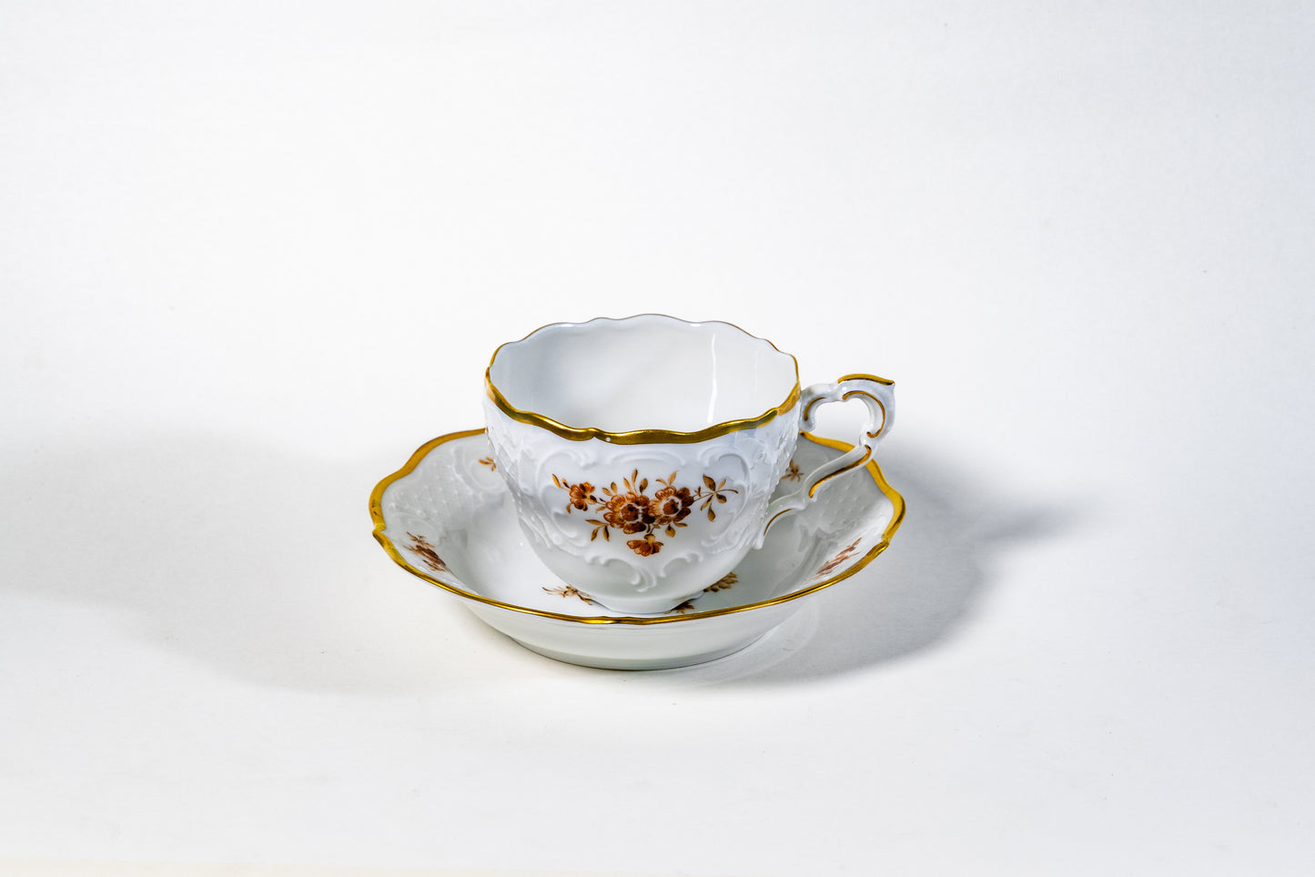 German Lindner Rococo-Style Coffee Cup – 22k Gilded Relief with Brown Floral Accents